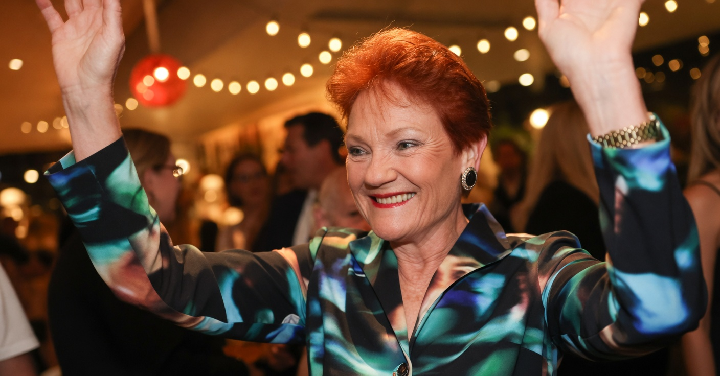 Pauline Hanson celebrating with arms raised after Farrer by-election victory